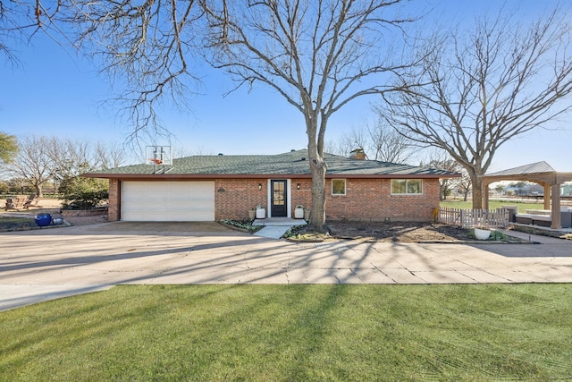 ranch-style house with driveway, an attached garage, a front yard, and brick siding