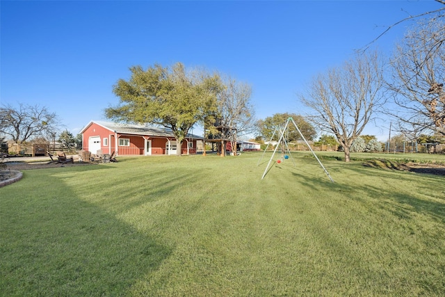 view of yard with a garage and playground community