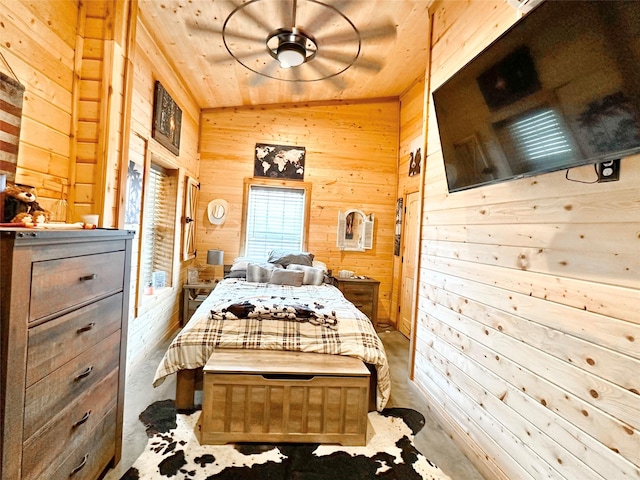 bedroom featuring wooden walls