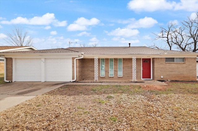 single story home featuring a garage, brick siding, driveway, and roof with shingles