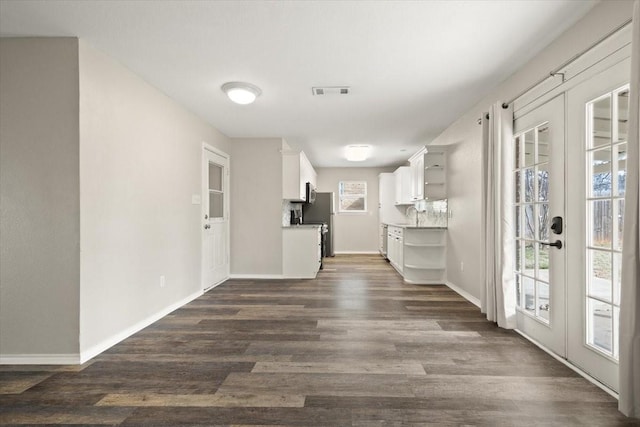 kitchen with dark wood-style floors, visible vents, open shelves, and french doors