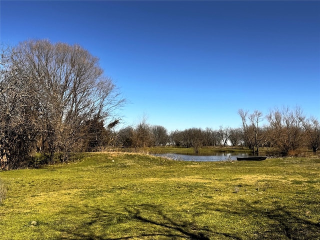 view of yard with a water view