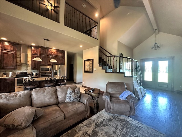 living room with high vaulted ceiling, french doors, stairway, beam ceiling, and hardwood / wood-style floors