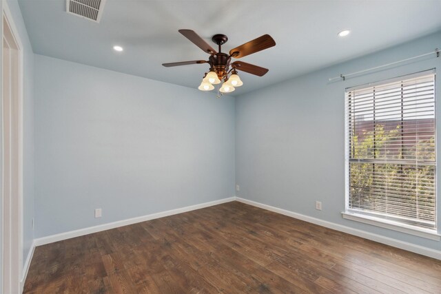 empty room featuring recessed lighting, baseboards, dark wood-style floors, visible vents, and a ceiling fan