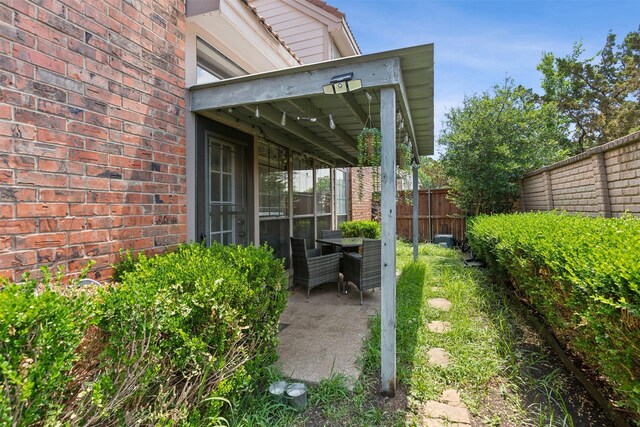 view of yard featuring a patio area and fence