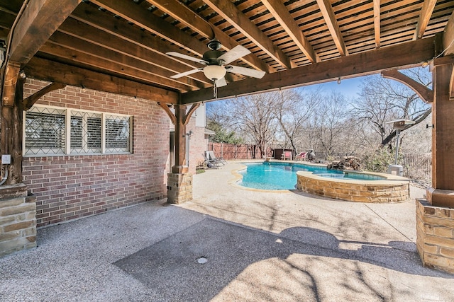 view of pool featuring a fenced in pool, a patio, a fenced backyard, ceiling fan, and an in ground hot tub