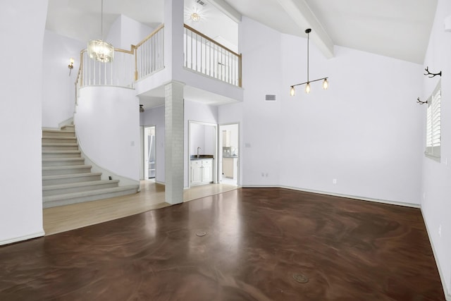 unfurnished living room featuring visible vents, stairway, beamed ceiling, concrete floors, and high vaulted ceiling