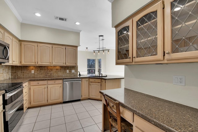 kitchen featuring visible vents, appliances with stainless steel finishes, ornamental molding, and light brown cabinetry