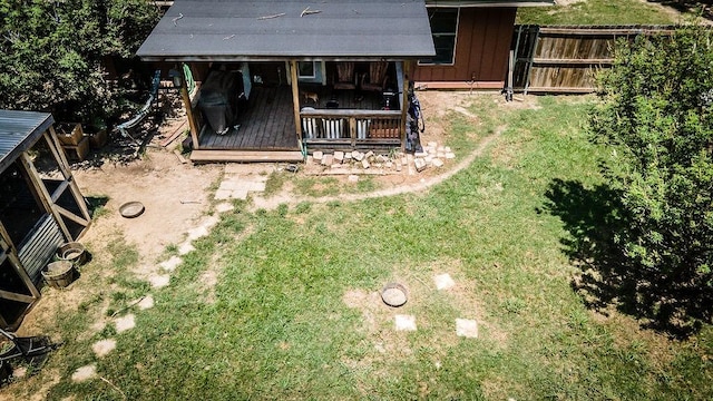 view of yard featuring an outbuilding and fence