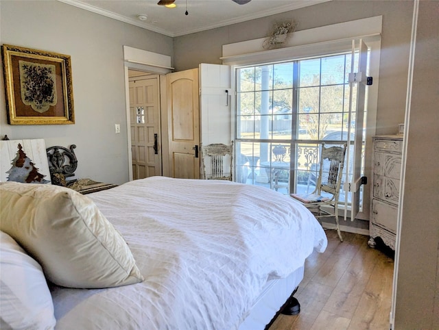 bedroom featuring light wood-type flooring and crown molding