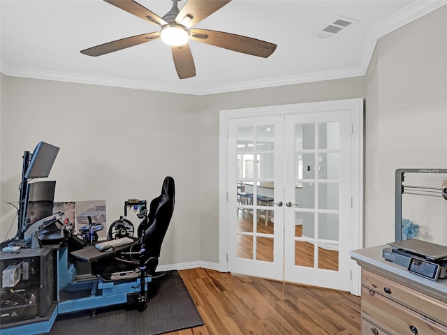 office space with crown molding, french doors, visible vents, and light wood-style floors