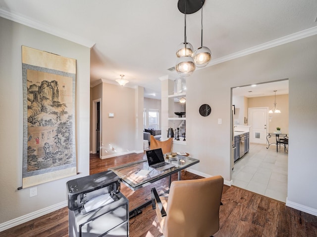 office space featuring crown molding, baseboards, and wood finished floors