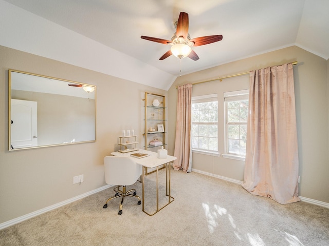 carpeted office featuring vaulted ceiling, baseboards, and ceiling fan