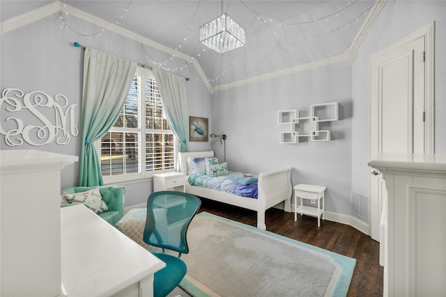 bedroom featuring visible vents, vaulted ceiling, crown molding, and wood finished floors