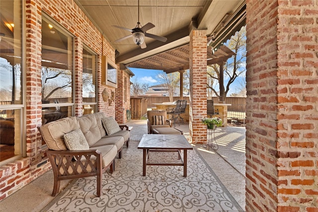 view of patio featuring ceiling fan, outdoor dining area, a fenced backyard, and an outdoor living space