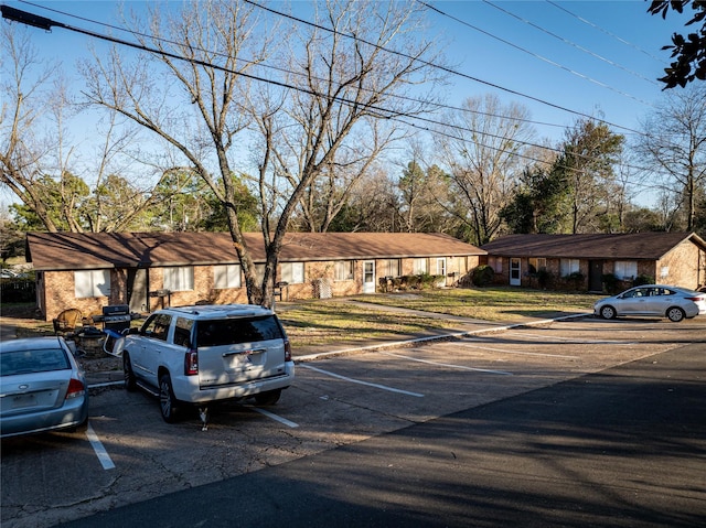 view of front of property featuring uncovered parking