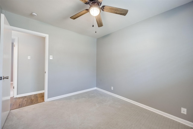 unfurnished room with ceiling fan, carpet, and baseboards