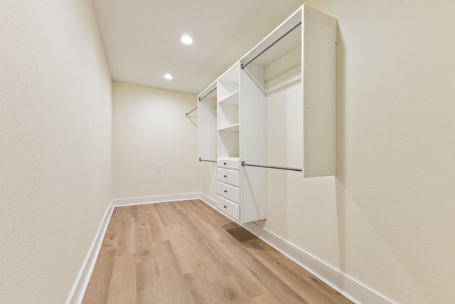 spacious closet featuring light wood-type flooring