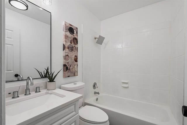 bathroom with bathing tub / shower combination, vanity, and toilet