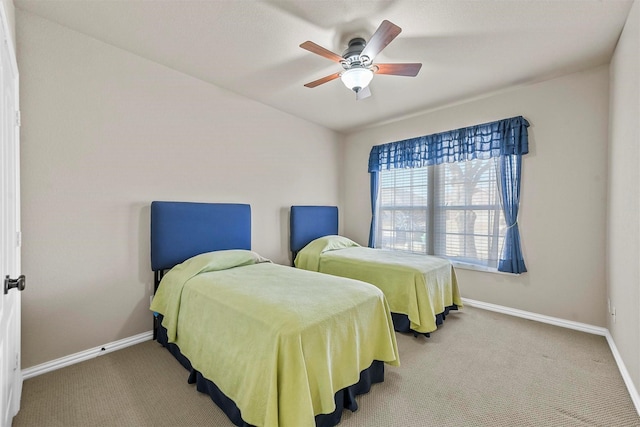 bedroom featuring carpet, baseboards, and ceiling fan