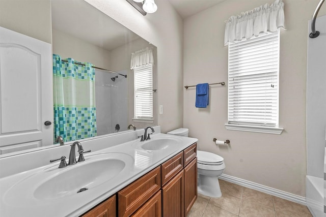 full bath with baseboards, a sink, toilet, and tile patterned floors