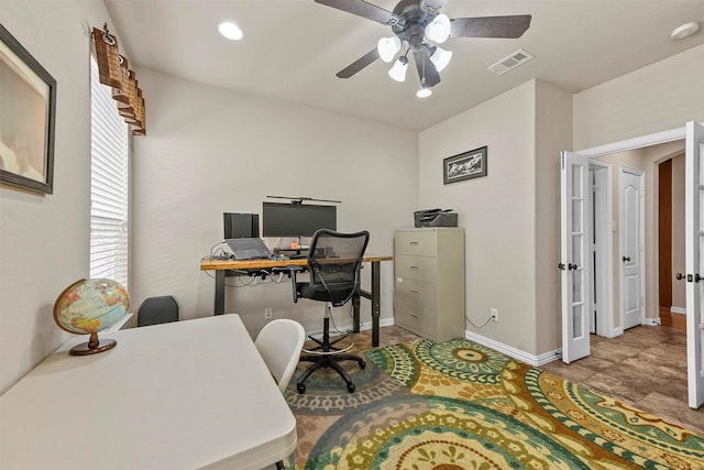 office with visible vents, ceiling fan, and baseboards