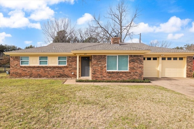 ranch-style home with concrete driveway, brick siding, and a front yard