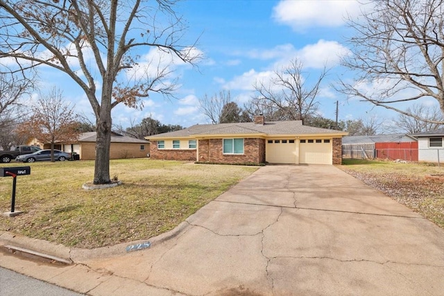 ranch-style home with a garage, brick siding, fence, a front lawn, and a chimney