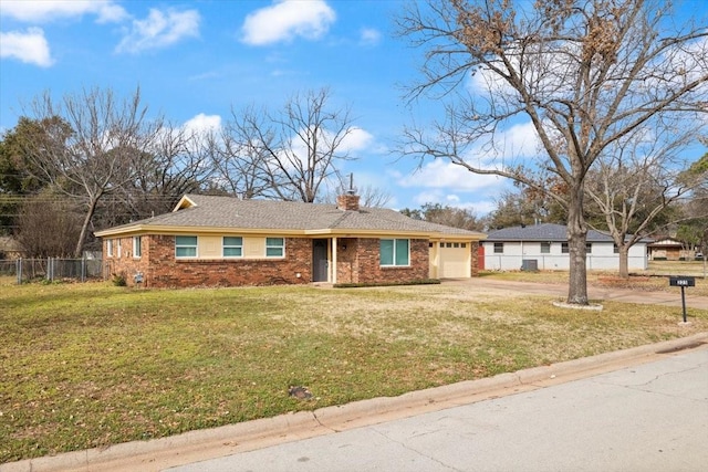 single story home featuring a front lawn, an attached garage, fence, and brick siding