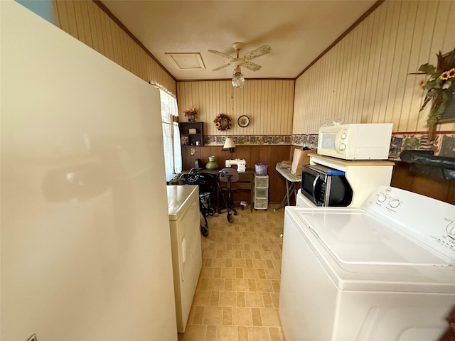 home office featuring ornamental molding, washer / clothes dryer, wood walls, and a ceiling fan