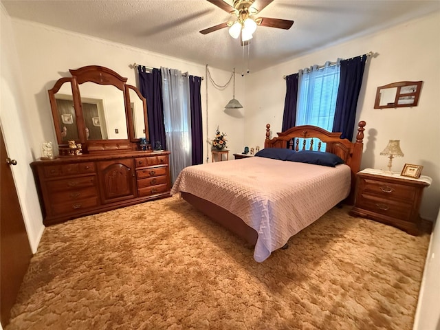 bedroom with light carpet, a ceiling fan, and a textured ceiling