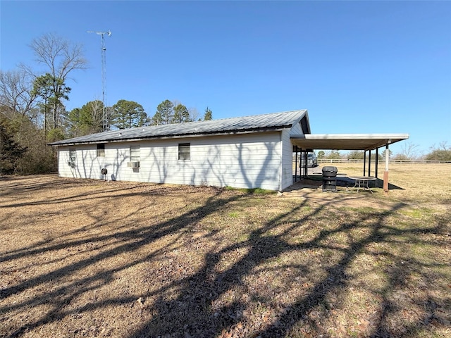 view of outdoor structure featuring an attached carport