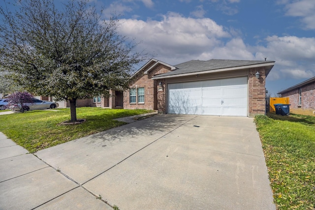 ranch-style home featuring a front yard, an attached garage, brick siding, and driveway