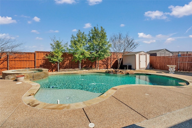 view of pool with a pool with connected hot tub, a storage shed, a patio area, a fenced backyard, and an outdoor structure