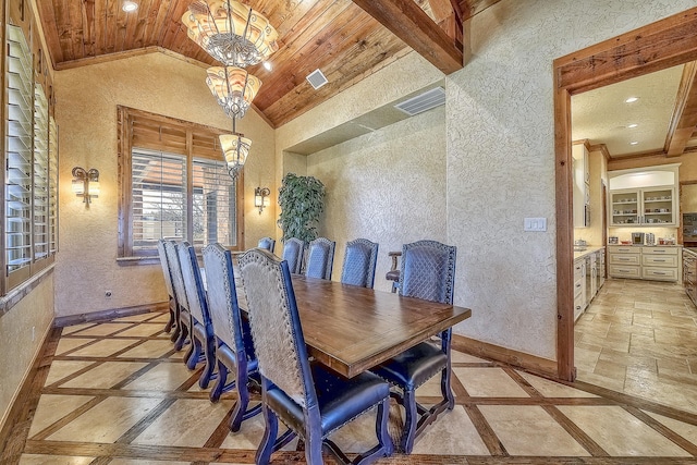 dining space with wood ceiling, baseboards, vaulted ceiling, and a notable chandelier