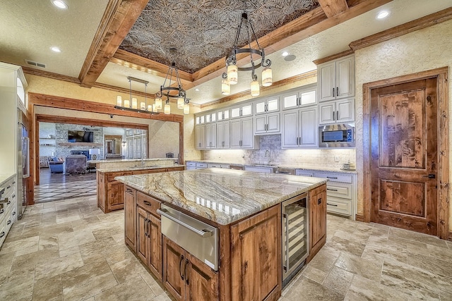 kitchen with wine cooler, decorative backsplash, a warming drawer, stainless steel microwave, and stone tile flooring