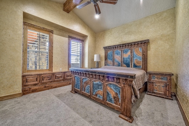 bedroom with vaulted ceiling with beams, carpet floors, a textured wall, and a ceiling fan