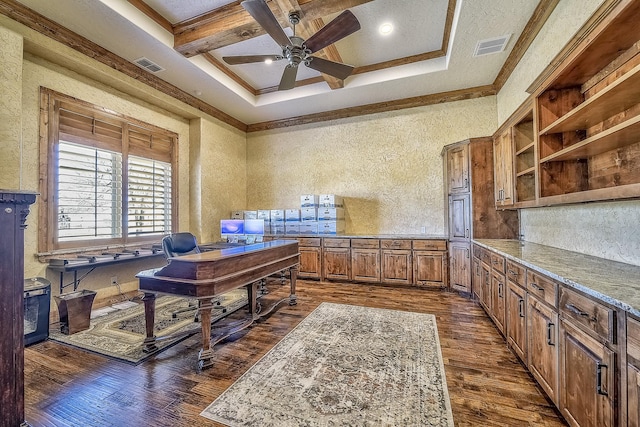 office space with dark wood-type flooring, visible vents, coffered ceiling, and a ceiling fan