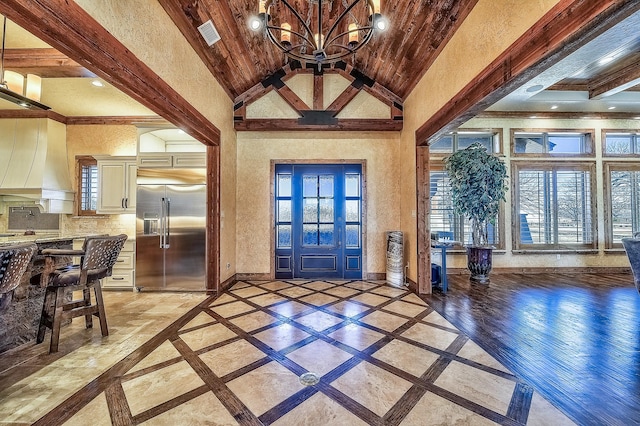 entrance foyer with visible vents, baseboards, wooden ceiling, high vaulted ceiling, and recessed lighting