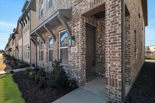 exterior space with brick siding