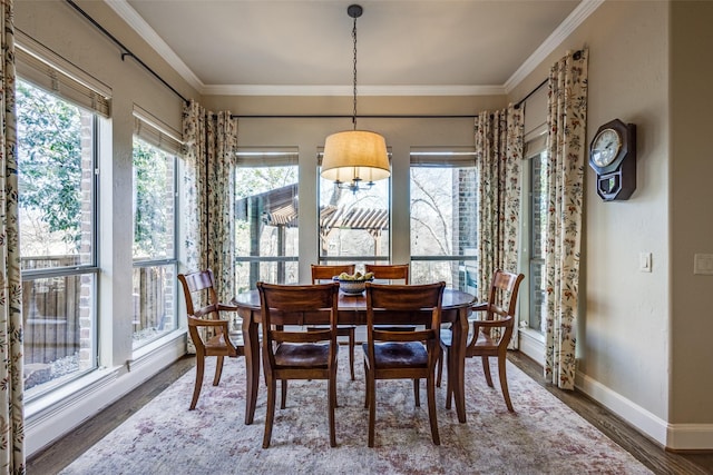 1313 Stoneoak Dr, Mckinney, TX 75072 - dining room with wood finished floors, baseboards, and ornamental molding
