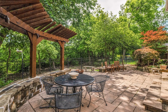 1313 Stoneoak Dr, Mckinney, TX 75072 - view of patio / terrace with a fenced backyard and outdoor dining space