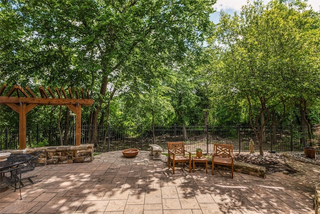 1313 Stoneoak Dr, Mckinney, TX 75072 - view of patio / terrace with an outdoor fire pit and fence