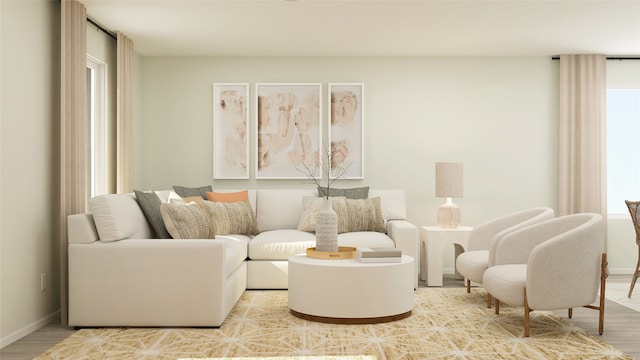 living room featuring baseboards and wood finished floors