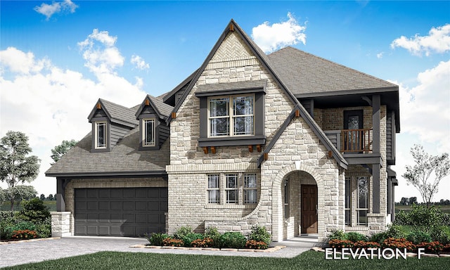 view of front of property with a shingled roof, a balcony, a garage, stone siding, and driveway