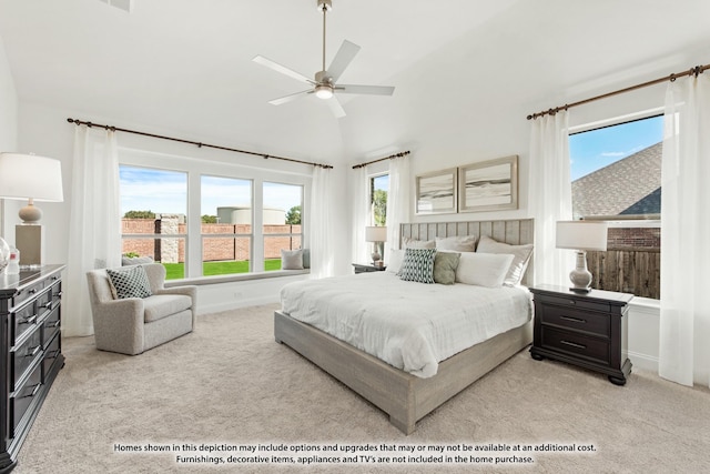 bedroom featuring light carpet, vaulted ceiling, and a ceiling fan