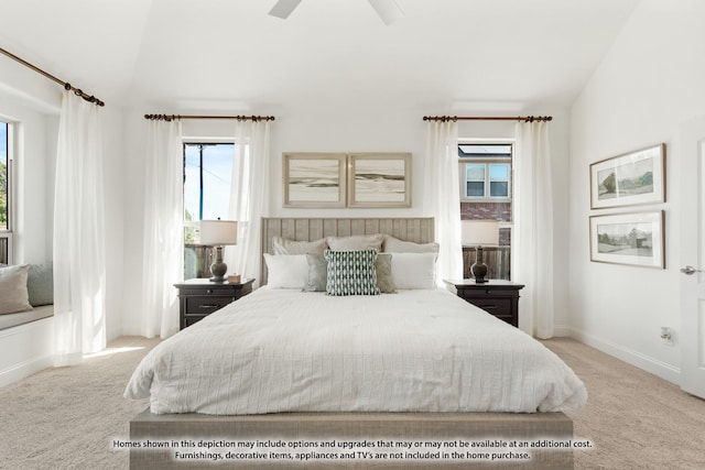 carpeted bedroom with ceiling fan and baseboards