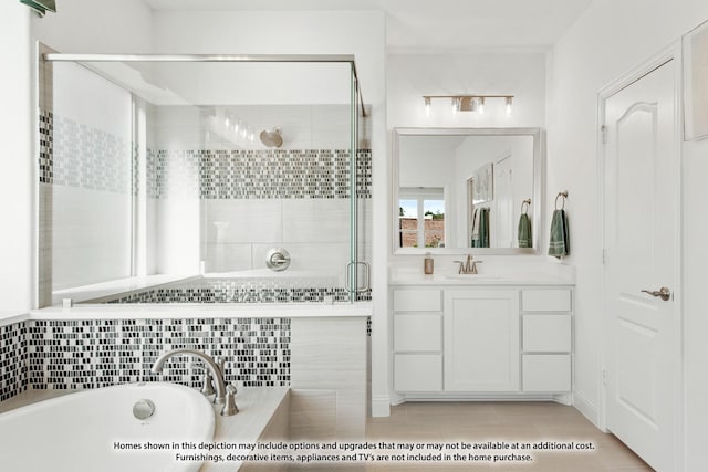 bathroom with a shower stall, a washtub, and vanity