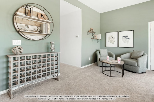 sitting room with carpet floors and baseboards