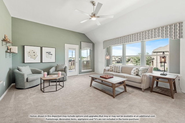 living area featuring vaulted ceiling, carpet floors, ceiling fan, and baseboards